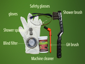 Image shows all the accessories needed to back-flush the Mini Vivaldi coffee machine. It has gloves, Machine cleaner, blind filter, special spanner, safety glasses, group head brush and a wire brush. All accessories have their corresponding name marked.