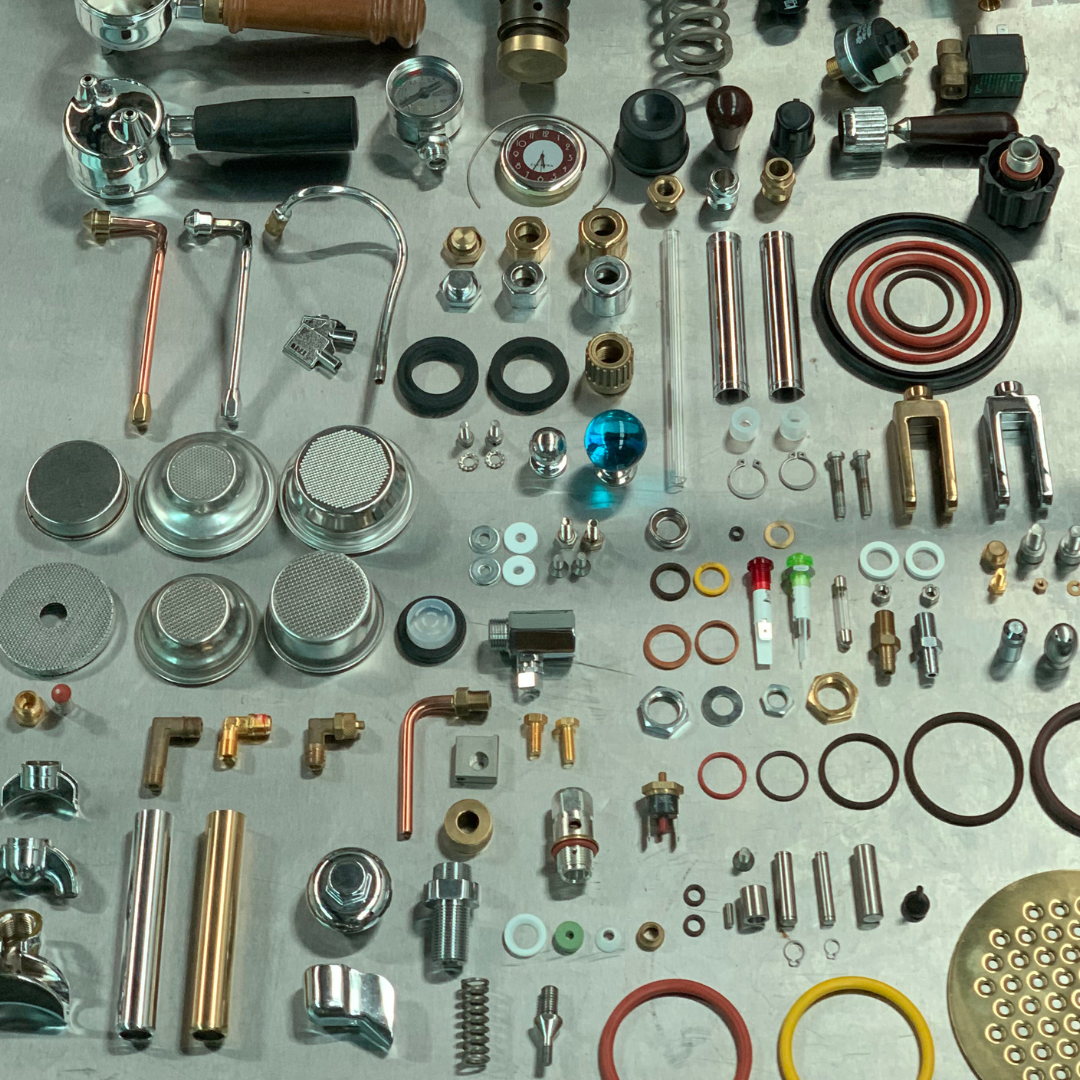 Elektra spare parts all laid out showing you the extensive inventory including boilers, seals , elements, portafilters, filter baskets, showers, spouts, group chambers, piston lever, switches, pumps, pressure switches, steam valves, steam wands etc.